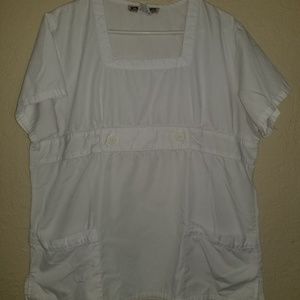 Two white scrub tops